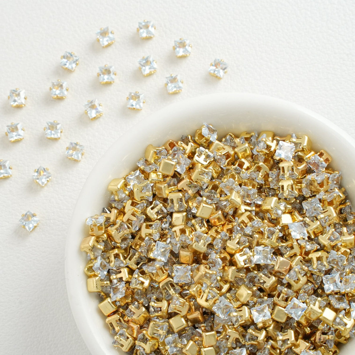 square lab-created CZ claw stones, gold plated-light lake blue